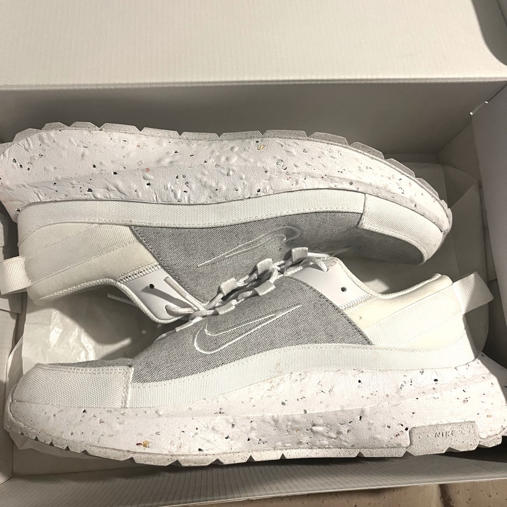 Grey & White Nikes. Worn a few times but is in excellent condition!